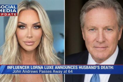 Lorna Luxe and her husband John Andrews smiling together in a black and white photo.