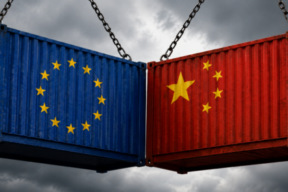 A digital graphic of the European Union flag forming a protective shield against a barrage of incoming shipping containers, overlaid with a 30% sourcing cap schematic.