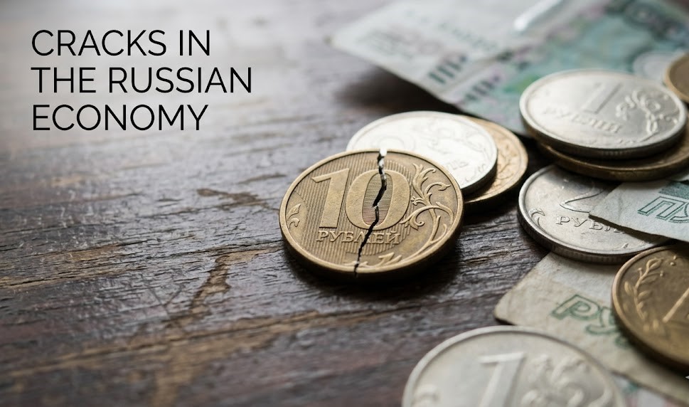 A digital graphic showing a fractured ruble symbol set against a background of rising military spending bars and falling consumer growth indicators.